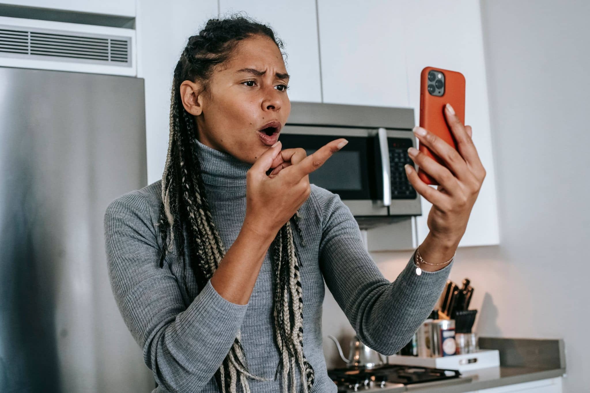 person shocked at content on phone